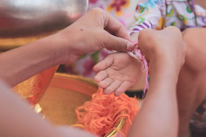 Baci Zeremonie beim Dorfbesuch - Traverse des Goldenen Dreieck mit der Anouvong